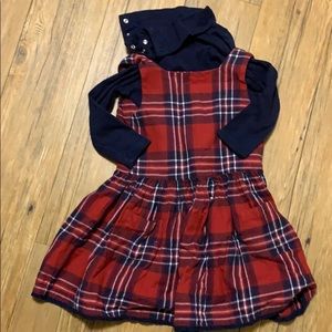 Plaid dress with navy turtle neck underneath.